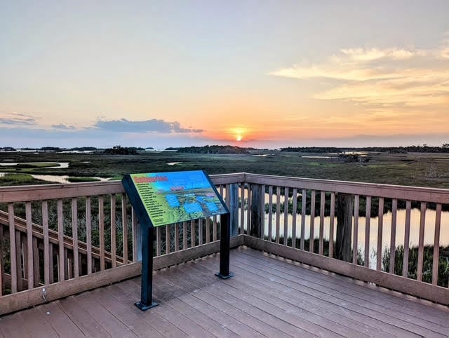 Withlacoochee Gulf Preserve look out point with info map and sunset